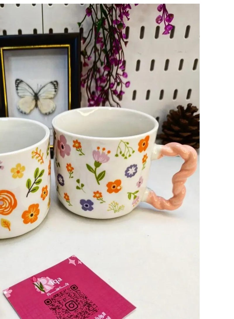 مج بورسيلين راقي سعة 380 ملي بنقوش أزهار ربيعية مبهجة وألوان برتقالية وصفراء زاهية مع يد وردية بتصميم مضلع مريح لليد - Image 4